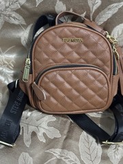 Steve Madden Brown Quilted Mini Backpack Zip Black Logo Straps Tassel Charm