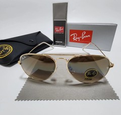 Ray-Ban RB3025 aviator sunglasses, gradient brown lenses.